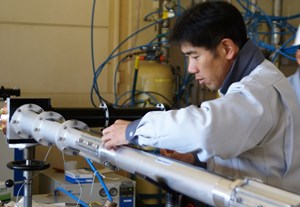 Koji Tajahashi (JAEA) is completing the installation of a transmission line before gyrotron tests. (Click to view larger version...)