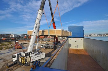 On Tuesday morning, two cranes hoisted the 30-tonne load onto the Echion and carefully deposited it at the bottom of the cargo hold. (Click to view larger version...)