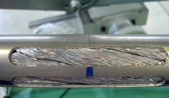 Two slots are machined on the jacket for helium entrance inside the conductor. Credit: Iberdrola Engineering, ASG Superconductors and Elytt Energy (Click to view larger version...)