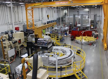 A partial view of the General Atomics module fabrication line, with two winding station tables visible behind a yellow rail. Photo: GA (Click to view larger version...)