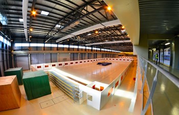 The clean area on the south side of the building will host two winding tables, where lengths of niobium-titanium conductor will be fed from two spools simultaneously (''two-in-hand'' winding), insulated, and wound into double pancakes. Dummy conductor for tooling qualification is stored in the crates, at left. (Click to view larger version...)