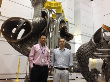Julio Guirao, from the ITER Common Port Plug Engineering team, and Yuhu Zhai, from the Princeton Plasma Physics Laboratory (PPPL), are working together to coordinate the effort toward a common component design that meets the challenging requirements for ITER diagnostics. They are pictured here at PPPL in front of coils from NCTX (the stellarator experiment that was cancelled in 2008). (Click to view larger version...)