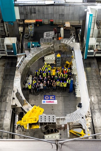 On the factory floor in Marghera, Italy, representatives of Fusion for Energy and contractor SIMIC celebrate the completion of the first European toroidal field coil. Nine others are in production. (Click to view larger version...)