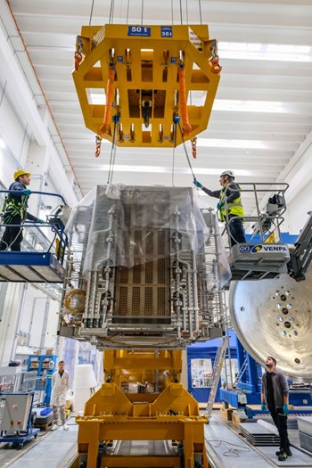 The beam source is lifted for installation. During the shutdown there were approximately 60 procurements for new or revised components for beam source enhancement. © Luca Lotto (Click to view larger version...)