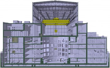 La construction du Complexe tokamak (un édifice de sept étages et de 400 000 tonnes) est en cours. Au centre on distingue l'écran de protection biologique (forme arrondie) qui entourera complètement la machine. (Click to view larger version...)