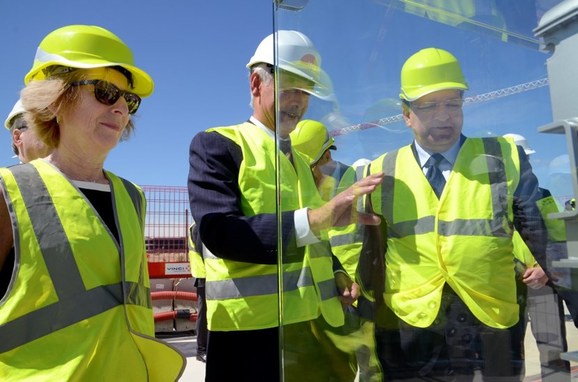ITER Director-General Motojima provides explanations to Mrs Fioraso and President Barroso in front of the ITER Tokamak mockup that had been specially moved to the Assembly Building basemat slab on the worksite for the occasion. (Click to view larger version...)