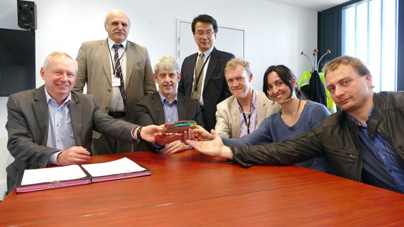 Holding up the plastic model of what will soon turn into a 10-ton diagnostic tool: Tokamak Engineering Department Head Alexander Alekseev, Russian Domestic Agency Head Anatoli Krasilnikov, Port Plugs & Diagnostics Integration Division Head Mike Walsh, ITER Deputy Director-General Eisuke Tada, Procurement Responsible Officer William de Cat, Diagnostic Engineer Natalia Casal, and Mikhail Kochergin from the Ioffe Institute in St. Petersburg. (Click to view larger version...)