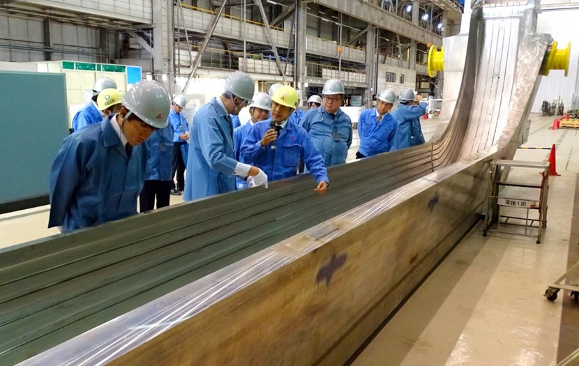 ITER Director-General Bernard Bigot visits the Mitsubishi facility in Kobe in October 2016, accompanied by officials from the Japanese Ministry of Education, Culture, Sports, Science and Technology (MEXT) and the Japanese Domestic Agency. Pictured, a 71-tonne inboard leg (''AU'') sub-assembly before final machining. (Click to view larger version...)
