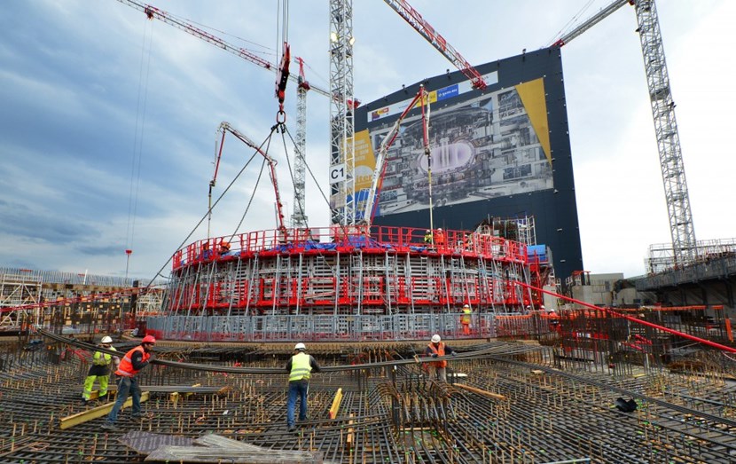 The circular structure of the bioshield now rises dramatically at the center of the Tokamak Complex. As concrete pouring proceeds, workers on the L1 level of the building are busy handling a bundle of 12-metre-long bars for the steel reinforcement of the neutral beam cell slab. (Click to view larger version...)