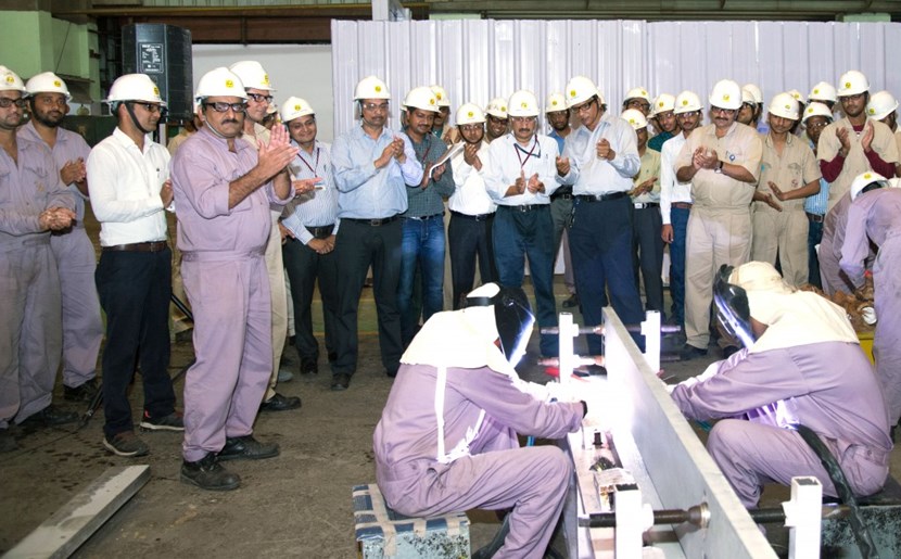 Members of the Larsen & Toubro cryostat team and ITER-India applaud the commencement of operations on the cryostat upper cylinder in March. (Click to view larger version...)