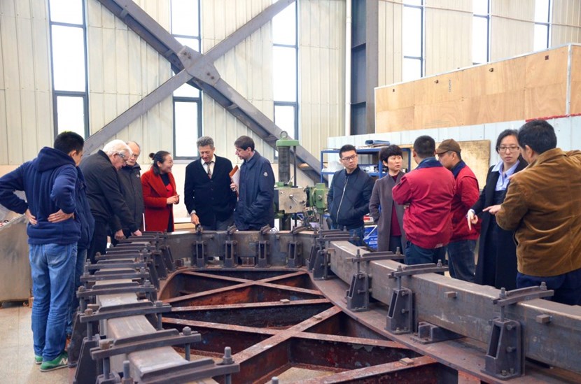 Experts and representatives of the ITER Organization and the Chinese Domestic Agency inspect a qualification coil case section in March. Six bottom coils, six side coils and six top coils will be installed around the Tokamak to correct magnetic error fields. (Click to view larger version...)