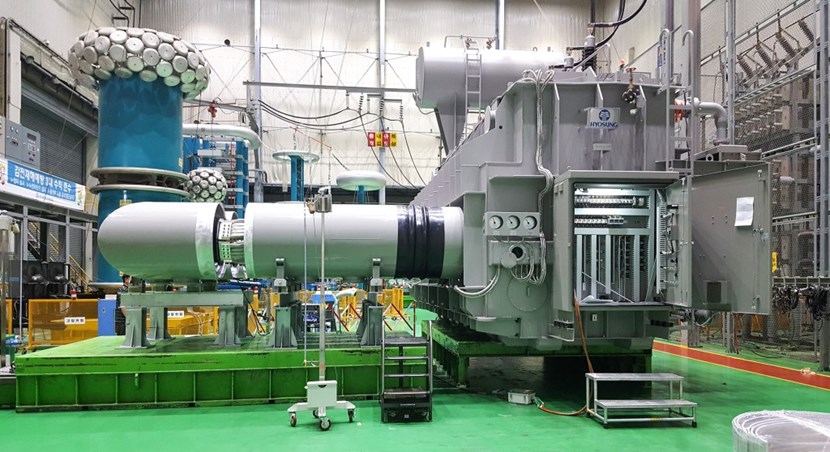 In July, the 130-tonne transformer (right) and the 4-metre-long busbar that connects it to the AC/DC converter were successfully tested at the Hyosung Factory in Changwon, Korea. The ''mushroom-like'' structures in the background belong to the high-tension testing equipment. (Click to view larger version...)