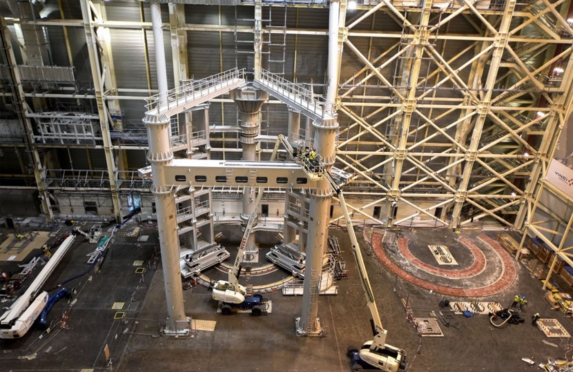 To the right of the nearly completed SSAT 1, the ''cradle'' for its identical twin is ready. The Titan tools are designed to handle combined loads in excess of 1,200 tonnes (one vacuum vessel sector, two toroidal field coils and thermal shielding) in excess of 1,200 tonnes. (Click to view larger version...)