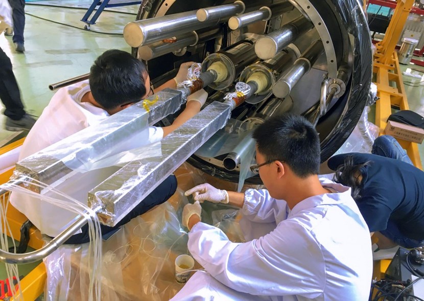 A cryostat feedthrough for a magnet feeder (seen here in the latest stages of assembly at ASIPP in China), is a maze of pipes and welding that only an endoscope can inspect. But how does one determine the device's orientation? The ITER Makers had an answer ... (Click to view larger version...)