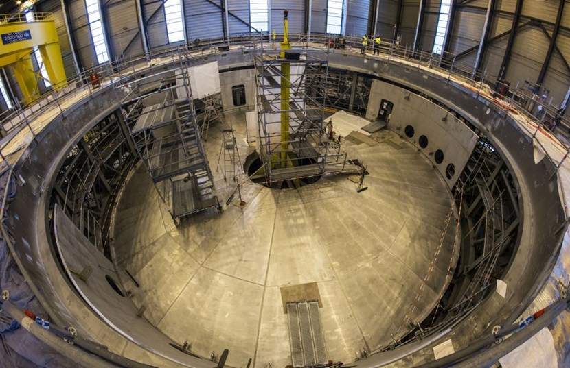 The components of the cryostat base—the 20-metre-in-diameter bottom disk, side shells, and 30-metre-in-diameter pedestal ring—are positioned for final assembly in the Cryostat Workshop. After welding, tests and final machining, site acceptance tests will be carried out in April 2019. (Click to view larger version...)