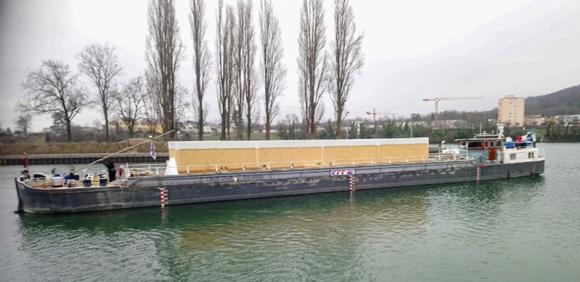 Sitting low in the barge, the cryogenic termination cold box will travel on the waterways of Europe for approximately four weeks to reach ITER. (Click to view larger version...)