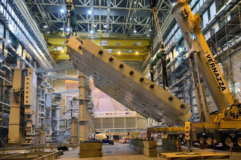When spectacular gives way to awesome: the 360-tonne dummy load, representing a toroidal field coil, is being slowly upended using both the double overhead crane at one end and a powerful telescopic crane at the other. (Click to view larger version...)