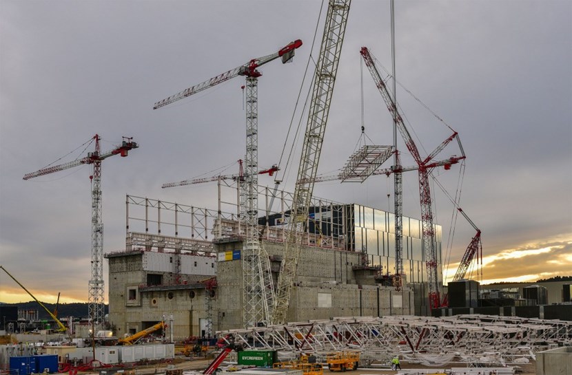 In the wee hours of 4 December, as the air was perfectly still and temperature just above zero degrees Celsius, the crawler crane extended its long arm, picked up the first module and lifted it slowly above the massive walls of the Tokamak Complex to the supporting columns. (Click to view larger version...)