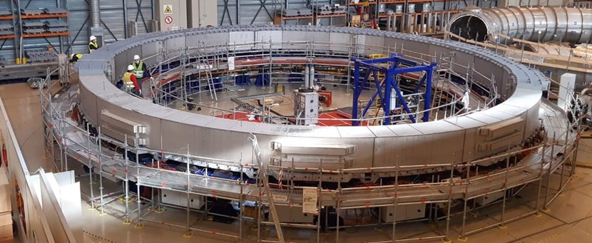 European contractors are removing the impregnation mould from poloidal field coil #5. A thin stainless steel cover remains that will be removed in order to check the quality of the work performed. (Click to view larger version...)
