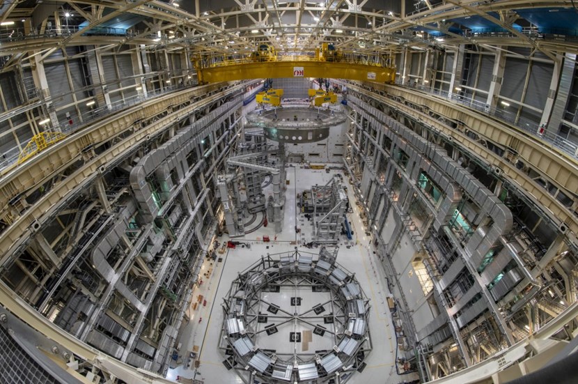 Moiving one metre per minute at an altitude of 24 metres, the 1,250-tonne component travels 110 metres from the entrance of the Assembly Hall, where it had been stored since mid-April, to the opening of the Tokamak assembly pit. (Click to view larger version...)