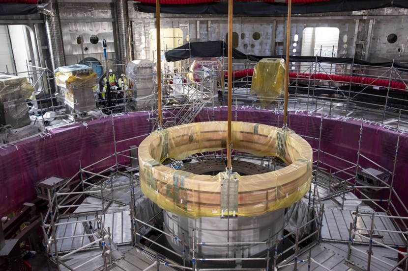 The set of three spare pre-compression rings was installed in the tight space between the bottom cylinder of the central column tool and the recently installed poloidal field coil #6. (Click to view larger version...)