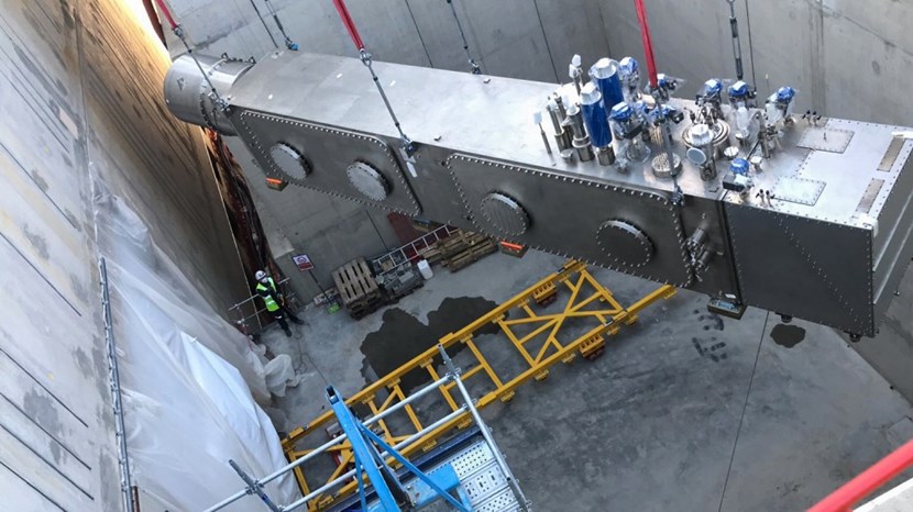 The coil termination box for poloidal coil #4 (PF4) weighs approximately 24 tonnes. It was introduced through an opening in the Tritium Building on 14 April and transported on rollers to its proper position outside of the bioshield. (Click to view larger version...)