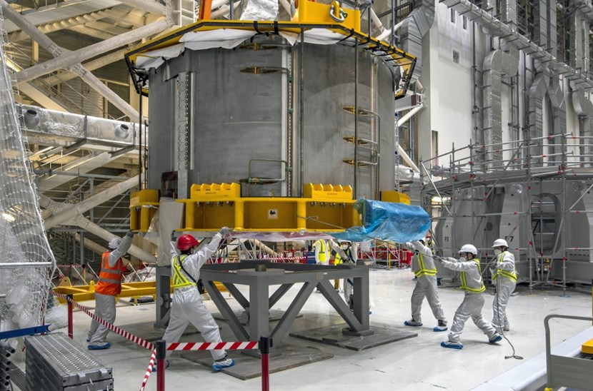 Equipment and tests will be performed on this simple ''table'' before the module is moved over to the assembly platform, visible on the right side of the image. (Click to view larger version...)