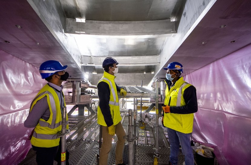 The top lid is also the most structurally complex of the four sections that make up the ITER cryostat. Curved in three directions like a skull cap, it is strengthened by an array of stiffeners and ribs. Here, from left to right: Dipen Shah, from Indian manufacturer Larsen & Toubro; Guillaume Vitupier, leader of the ITER cryostat group; and Girish Kumar Gupta, ITER cryostat engineer. (Click to view larger version...)