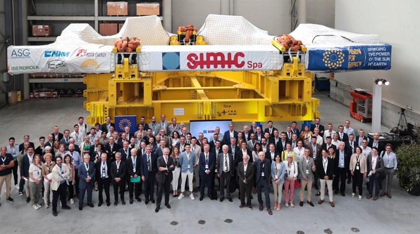 Attendees of the SIMIC Open Day on 27 May stand before toroidal field coil #14 (TF14)—the eighth completed out of ten. This procurement program has been a 14-year adventure for the European Domestic Agency, involving 40 companies and more than 700 people. © SIMIC (Click to view larger version...)