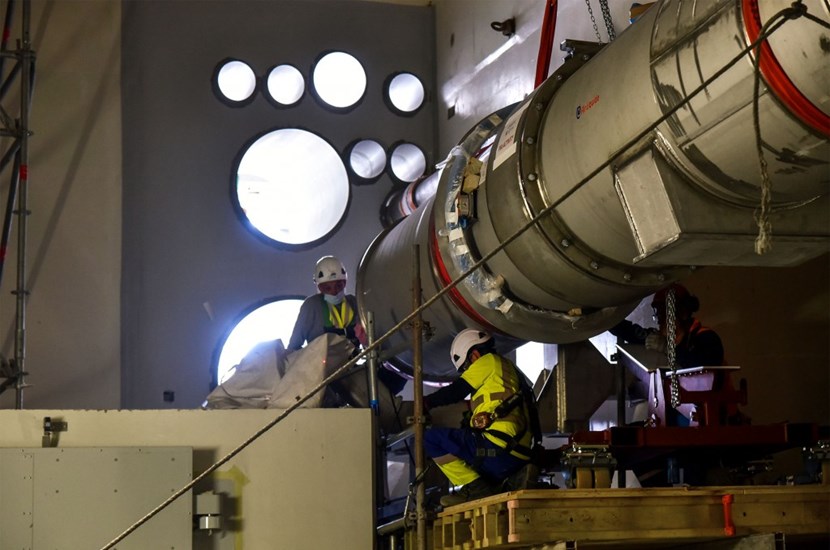 With the insertion of this massive elbow-shaped spool, total cryoline installation inside the Tokamak Building is now close to 75% complete. Inserted into a wall opening, the spool will connect the cryolines installed inside the building to those coming from the cryoplant along the elevated ''cryobridge.'' (Click to view larger version...)