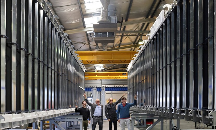 From left to right, standing between the two panels of the cryopump at SMDS France, supplier to Fusion for Energy (F4E): Dani Dupuy, F4E cryopump specialist; Robert Pearce, Head of the ITER Vacuum Section; Matthias Dremel, former ITER staff member, now an external advisor; and Jamie Buckerfield, ITER vacuum cryopump engineer. (Click to view larger version...)