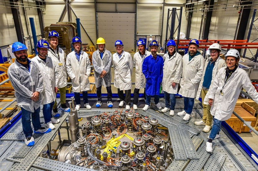 Robert Pearce (centre), Vacuum System Project Leader, gathers past and present actors of the 20-year cold valve box adventure for a ''pat in the back'' moment in the vacuum lab. (Click to view larger version...)