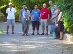 Intercultural knowledge (here, staff attempting to master the art of "pétanque") is essential to living in a foreign country.  