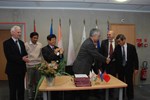 A moment of joy and relief: the Director-General of the ITER Organization, Osamu Motojima, and the Directors of all seven Domestic Agencies (US ITER not pictured) signing a Memorandum of Understanding for the use of a single Logistics Service Provider.