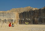 In a scene reminiscent of an Apollo Moon mission, geologists take measurements in the Tokamak excavation pit.