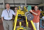 Sergei Putvinski (left) and fusion physicist François Saint-Laurent (IRFM) are not manning a Gatling machine gun. They  stand next to the prototype DMS gun cartridge that will run its first tests at the end of the month.  