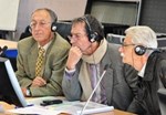 President of the Public Enquiry Commission André Grégoire (centre) and colleagues Michel Thibault (left) and François Coletti listen intently as ITER Deputy Director-General Carlos Alejaldre presents the most recent developments in the ITER Project.