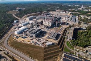 Aerial photo of the ITER France site, a large grouping of very big buildings under construction.